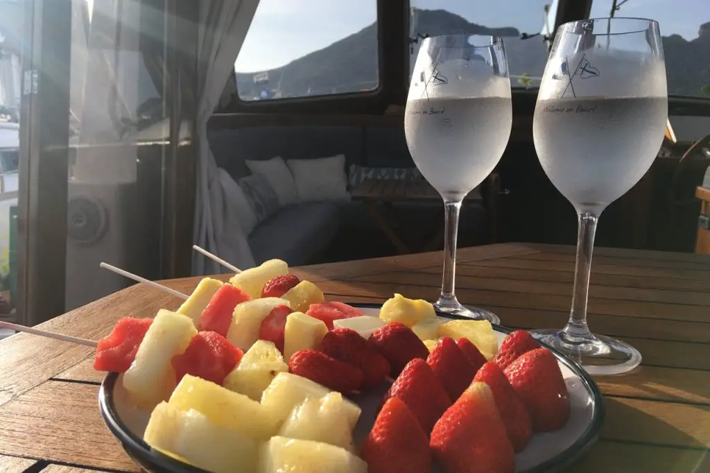 fruit kebabs and refreshing drinks served on a boat