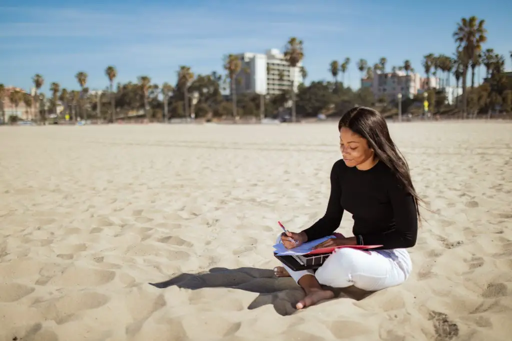 Woman working on beach