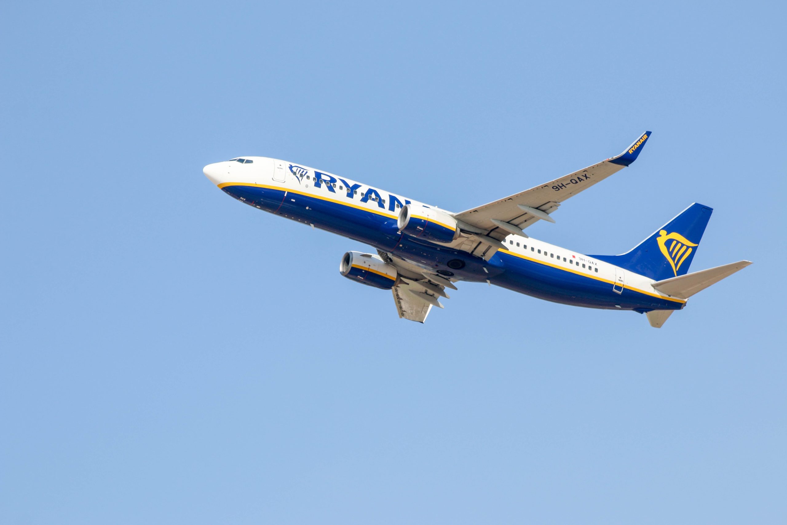 Ryanair plane taking off in blue sky